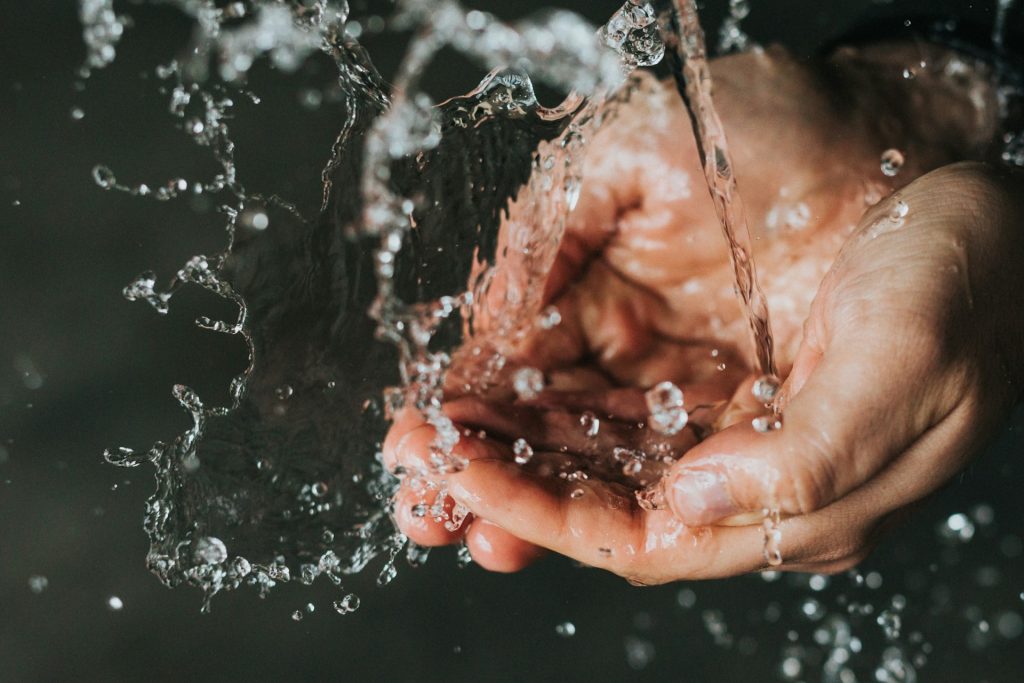 washing hands in sink