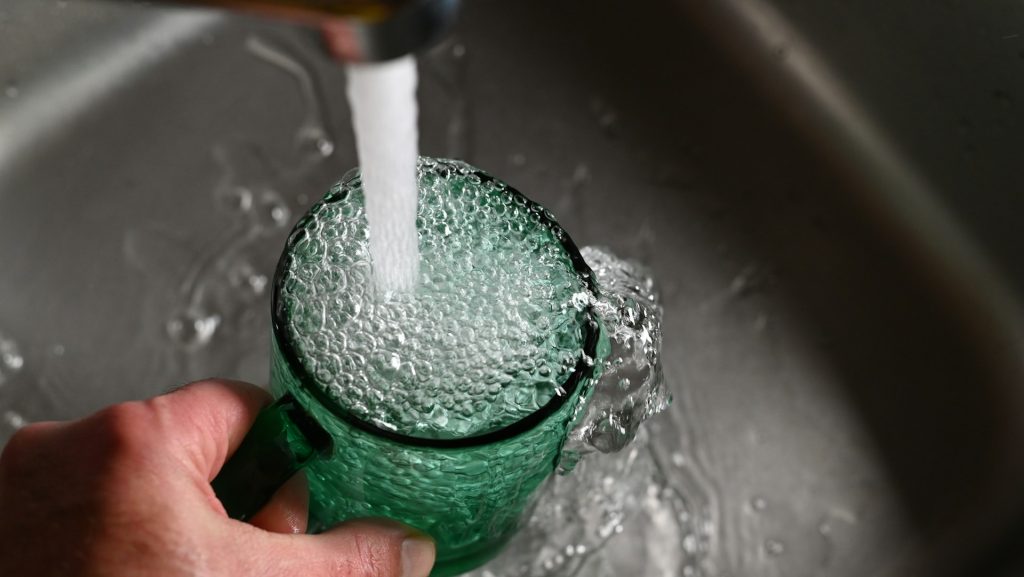 getting a glass of water from tap