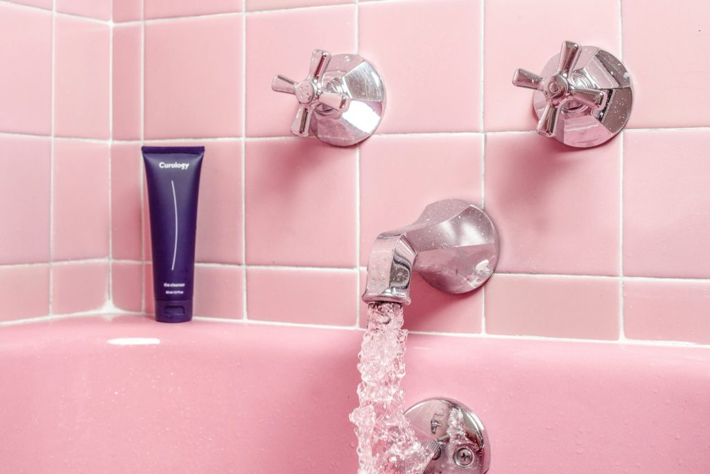 water flowing from bath faucet
